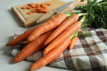 Concept of fresh vegetable with carrot on white textured table