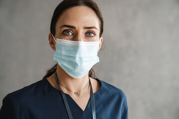 Confident mid aged brunette woman doctor