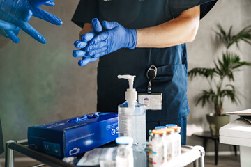 Close up of two doctors sterilizing hands before surgery