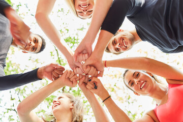 Group of friends greet each other with fists