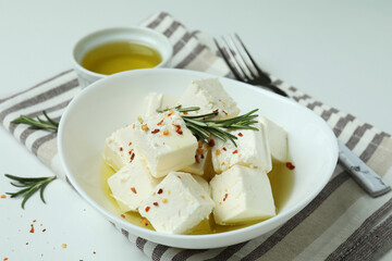 Concept of tasty food with feta cheese on white background