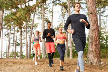 Young people in a running group in nature