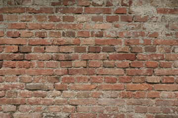 Ziegelmauer / eine alte Mauer aus roten Ziegeln (Textur / Hintergrund / Deko)