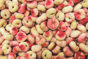 Saturn peaches. Colorful fruit background, pan tao