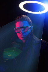 Cyberpunk style portrait of man in futuristic costume.