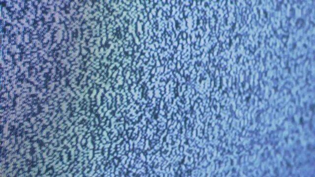 White Noise TV. No signal on TV. Static noise interference. Noise tv background. Flicker old retro TV screen with static noise caused by a poor signal. 4K. Close up.