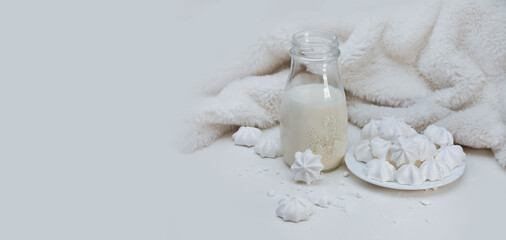 meringues and milk on a light background