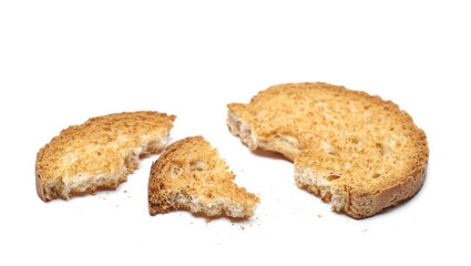 Broken rusk with crumbs isolated on white background