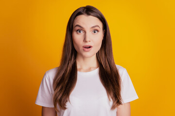 Photo of shocked excited lady open mouth wear white t-shirt on yellow background