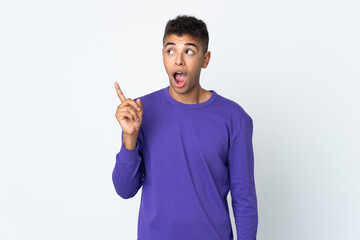 Young brazilian man isolated on white background intending to realizes the solution while lifting a finger up