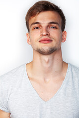 Obraz premium young handsome teenage hipster guy posing emotional, happy smiling against white background isolated, lifestyle people concept