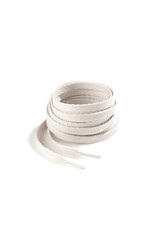 Subject shot of white shoe strings with thin tips. Flat shoe laces are rolled into coil and isolated on the white background.
