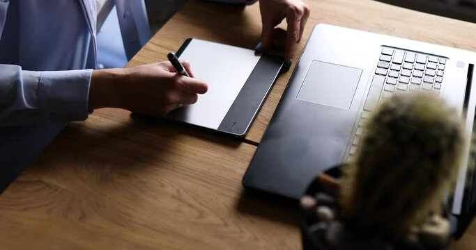 Creative female graphic designer draw on graphic table, working on creative project at home, Illustrator hands scetching on tablet computer, using stylus, Concept of modern art and technology.