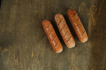 Smoked pork sausages, isolated on white background.