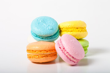 Colorful cake macaroons on a light background
