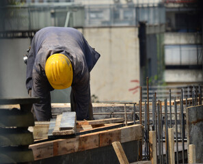construction worker on top of a building