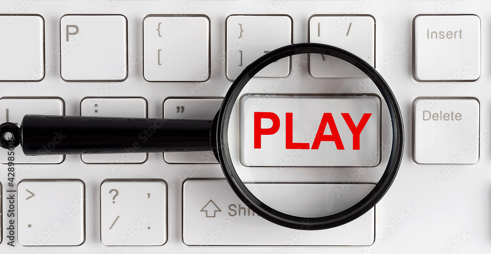 Poster computer keyboard with word play on white button, closeup