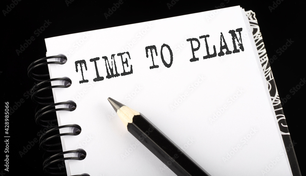 Poster time to plan written text in a small notebook on a black background
