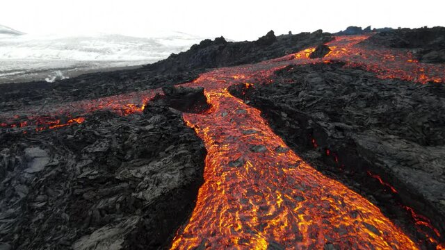 Flying Low close to Hot lava magma revealing Mount Fagradalsfjall, Iceland
4K Rare drone shot from Iceland of Hot lava and magma coming out of the crater, April 2021 
