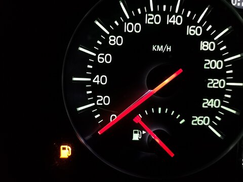 Empty tank. Speedometer with an arrow at zero. The fuel has run out. Crisis. A car does not go. Speed 0. Vehicle dashboard. Dial with a red arrow. Illuminated night device. Urgent refueling is needed