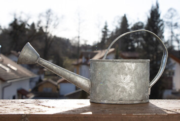 old watering can in garden