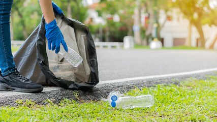 Collect garbage in the ecological group park. Concept of environmental protection. Team up with external recycling projects