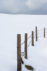 pasture fence in the snow