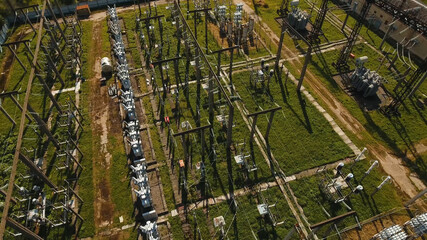 Aerial view Power plant, transformation station, cables and wires. High voltage electric power...