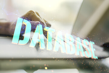 Double exposure of Database word sign with hands typing on computer keyboard on background, global research and analytics concept