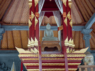 Statue of the Buddhist God Buddha in the Buddhist temple Brahma Vihara Arama with statues of the...