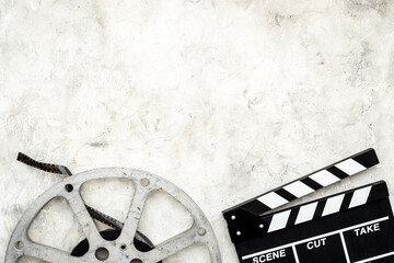 Big film reel with movie clapperboard, top view. Cinema concept