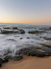 High tide water flowing in the rocky coastline.