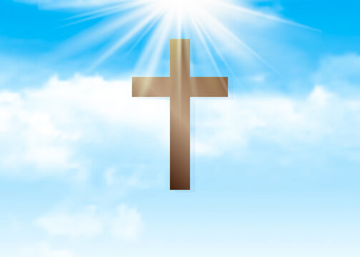 Christian cross on a background of blue sky in the sun.