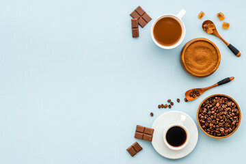 Espresso in white cup and coffee beans, top view. Coffee background