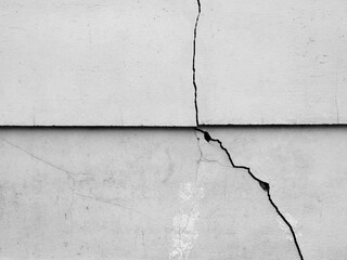 old white wall with crack from earthquake effect