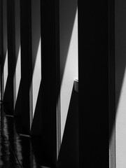 black and white architeture, shadow on white pole with sunlight