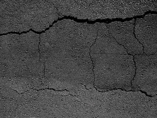 Obraz premium black asphalt road with crack texture, effect of earthquake