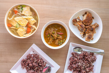 Panang thai red curry with egg soup and asian deep fried chicken eat with steam rice