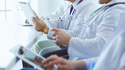 Medical team sitting and discussing at table