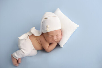 Newborn baby boy sleep on blue blanket. Cute sleeping newborn
