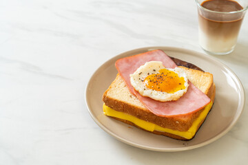 bread toasted cheese topped ham and fried egg with pork sausage