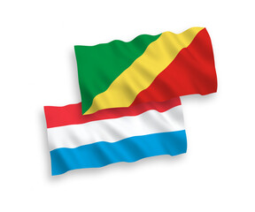 National vector fabric wave flags of Republic of the Congo and Luxembourg isolated on white background. 1 to 2 proportion.