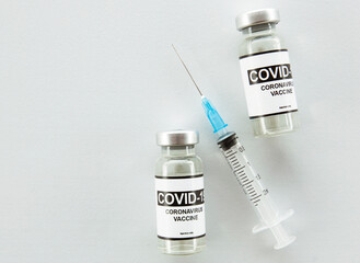 Covid-19 coronavirus vaccine and syringe