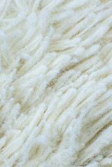 White cotton towel or carpet.fluffy texture background. Close up, macro photo. Soft focus image.