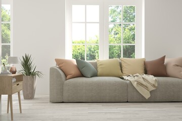 White living room with sofa and summer landscape in window. Scandinavian interior design. 3D illustration