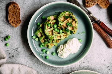 Zucchini waffles with cream cheese. Vegetarian green waffles