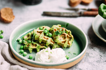Zucchini waffles with cream cheese. Vegetarian green waffles