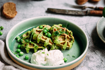 Zucchini waffles with cream cheese. Vegetarian green waffles