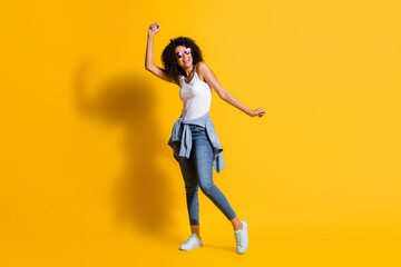 Fototapeta na wymiar Full body photo of afro american woman dance wear tight waist jacket sunglass isolated on funky yellow color background