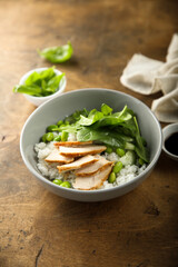 Healthy rice bowl with chicken and spinach